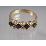 A yellow metal, diamond and sapphire dress ring, size N/O, 5.3g