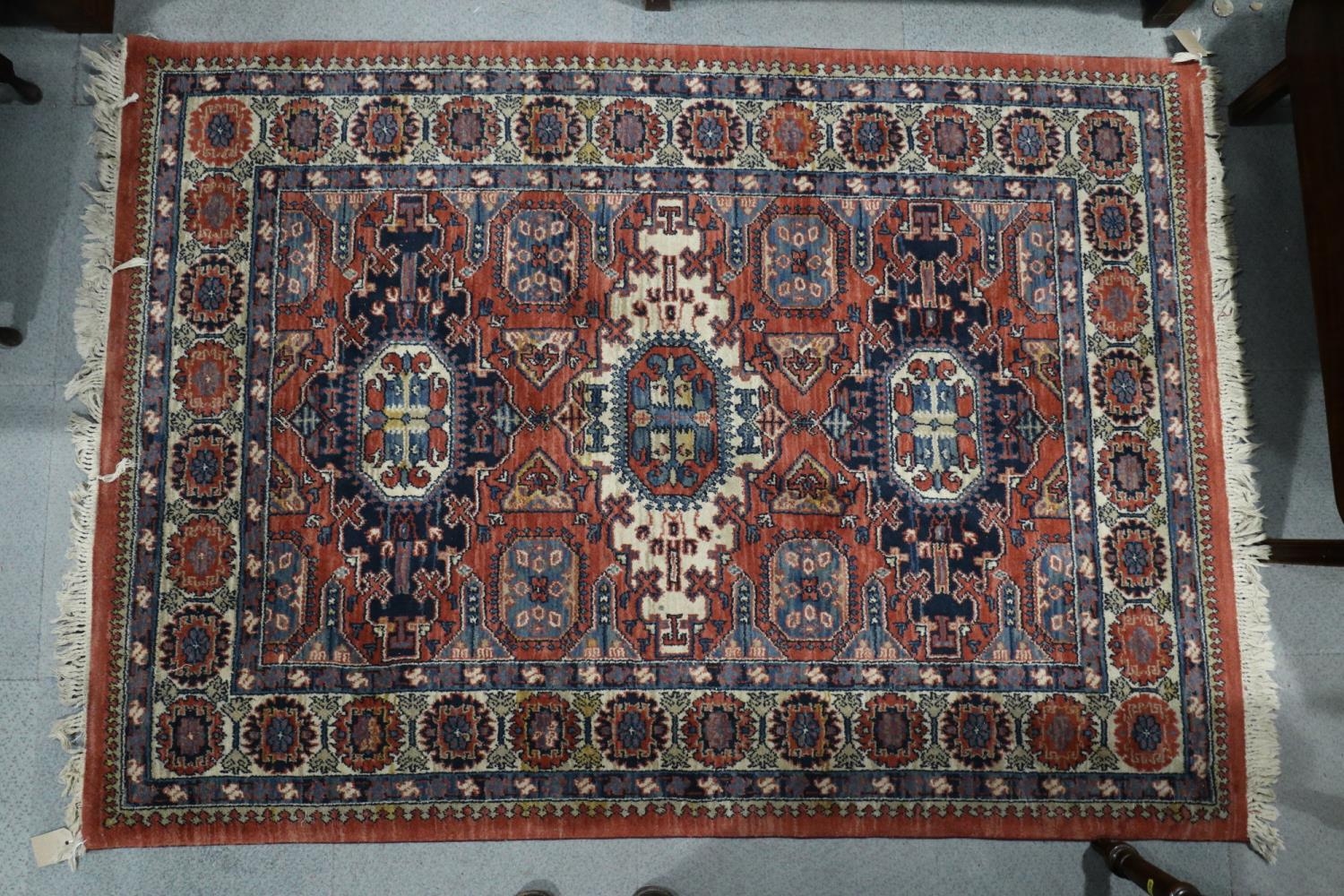 A Louis de Poortere rug of traditional Persian design with geometric design, 54 1/2" x 77" approx