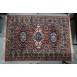A Louis de Poortere rug of traditional Persian design with geometric design, 54 1/2" x 77" approx