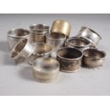 Seven silver napkin rings, various, 5.1oz troy approx, and four other napkin rings