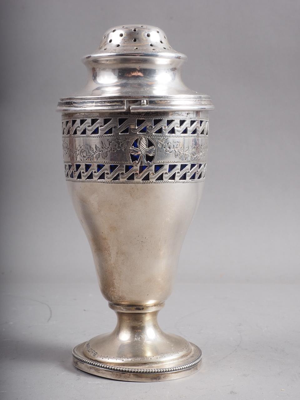 A silver sugar shaker with engraved floral swag decoration and associated white metal top, 2.6oz