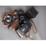 A Voiglander Vitor CLR camera, in travel case, and three other cameras