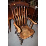 A 19th century Windsor lath back farmhouse elbow chair, on turned and stretchered supports