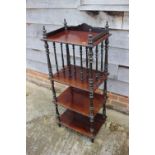 A Victorian rosewood four-tier whatnot with galleried top, on turned supports, 18 3/4" wide x 13 1/