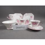 A Shirley bone china "Apple Blossom" part tea service, comprising nine cups, ten saucers, ten