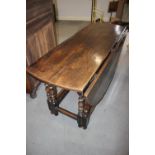 An 18th century oak oval gate leg dining table, on slender turned supports, 54" wide