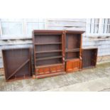 A 19th century walnut open bookcase with fitted adjustable shelves and cupboards