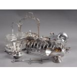 A silver plated nautilus shell shaped spoon warmer, a butter dish, a toast rack and other items