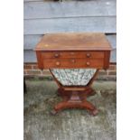 A 19th century mahogany work table, fitted two drawers and well, on shaped support and quatreform