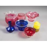 A ruby glass and lamp work shallow bowl, two similar pieces of glass, a Venetian style blue and
