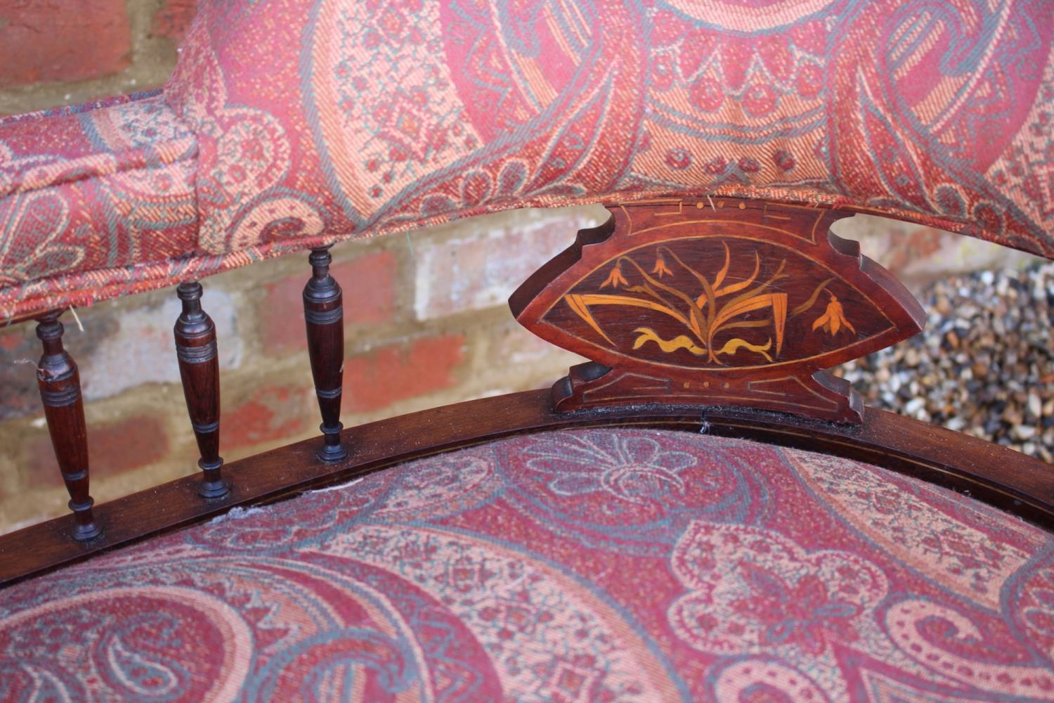 An early 20th century rosewood and line inlaid "conversation" settee with splat and spindle padded - Image 4 of 7