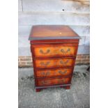 A mahogany and banded side cupboard enclosed faux drawer front door, 21" wide x 19" deep x 33" high,