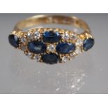 An 18ct gold, diamond and sapphire dress ring, size P, 4g