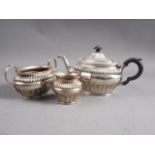 A three-piece silver teaset with gadrooned decoration, 29.5oz troy approx