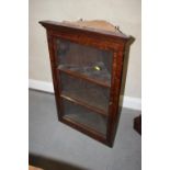 An oak corner hanging cabinet enclosed three panel glazed door, 23" wide x 12" deep x 33" high