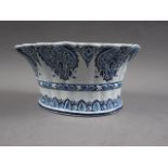 A Delft blue and white semicircular tulip stand, 9 1/2" wide (chip to foot rim)