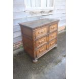 A largely early 18th century oak chest of two short and two long drawers, on bun feet, 43" wide x