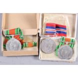 A group of three WWII medals with card boxes to Mr S W F Johnson and Mrs Margaret H Johnson