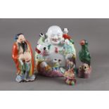 A Chinese figure of Buddha with impressed mark to base, 11 1/4" high, two other figures and a