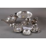A silver plated pedestal fruit bowl, a plated sugar chute, a plated cruet stand, a plated toast rack