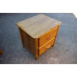 A light oak bedside cupboard, fitted two drawers, 20" wide, and a similar two-tier occasional table,