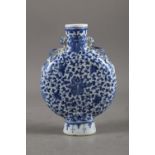 A Chinese blue and white moon flask with relief lizard, leaf and scrolled decoration, 9 1/2" high