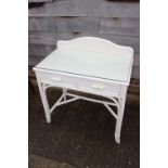 A white painted ledge back dressing table, fitted two drawers, 31" wide, a similar white painted