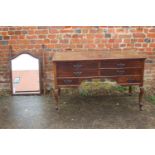 A mahogany dressing table, fitted mirror over two short, one long and two small drawers, with copper