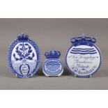 Three Copenhagen porcelain retailer's wall plaques, various designs, largest 9 1/2" high