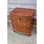 A bachelor's mahogany bowfront chest of four long drawers, 24" wide x 18" deep x 29" high