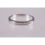 A white metal and diamond half eternity ring, 0.33ct weight, size Q, 3.8g