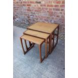 A nest of three G-Plan teak occasional tables, largest 21" wide