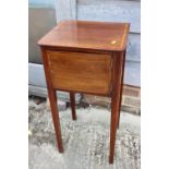 An Edwardian walnut and line inlaid bedside cupboard enclosed one door, on square taper supports,