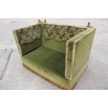 A Knole settee, upholstered in a green velvet with brocaded panels, 66" wide x 36" deep x 37" high