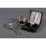 A silver egg cup and spoon set, in fitted box, a silver napkin ring, in box, 2.7oz troy approx,