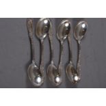 A set of six white metal soup spoons with embossed floral decoration, stamped Sterling, 8.4oz