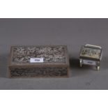 An Oriental embossed white metal and burr wood cigarette box, and a vestas box with painted cover