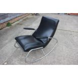 A 1960s chrome frame rocking chair with black leatherette seat