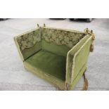 A Knole settee, upholstered in a green velvet with brocaded panels, 66" wide x 36" deep x 37" high