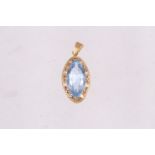 A yellow metal and blue spinel oval-shaped pendant with rope twist borders, 5.6g gross