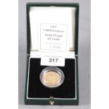 A gold proof £2 coin, dated 1997, in fitted case with certificate