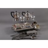 A silver plated  double entree dish and covers, in two-handled stand, a plated three-piece teaset, a