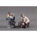 Two Royal Copenhagen figures, "Faun with Bear Cub" (648) and "Faun with Magpie" (2113)
