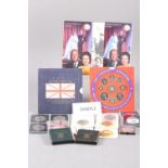 A collection of United Kingdom commemorative crowns, £5 coins and cased coins