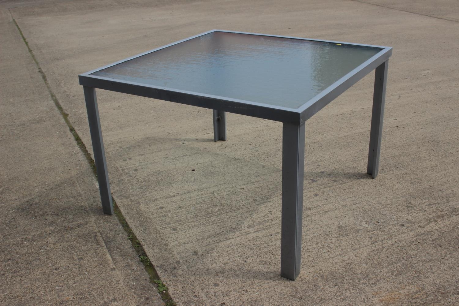 A glass top garden table, 43" square x 28" high