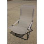 An Outwell folding garden recliner/sunbed and two similar recliners