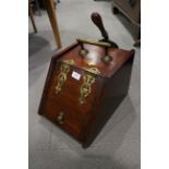 An Edwardian mahogany and brass mounted coalbox with scoop, 11" wide