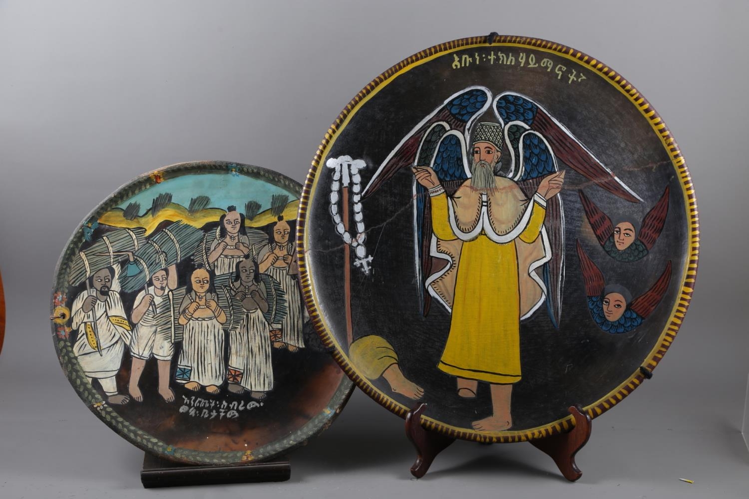 A Coptic/Ethiopian figure decorated charger, 18" dia, and a Coptic/Ethiopian Saint decorated