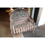 A cast iron fire basket with demi-lune swag decorated back, 17" wide x 11" deep x 20" high