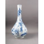 A Chinese blue, white and iron oxide bulbous bottle neck vase with figures in a landscape